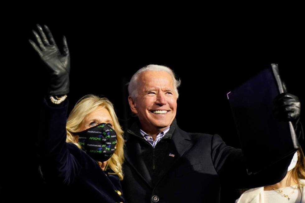 Democratic presidential candidate former Vice President Joe Biden stands with his wife Jill Bid ...