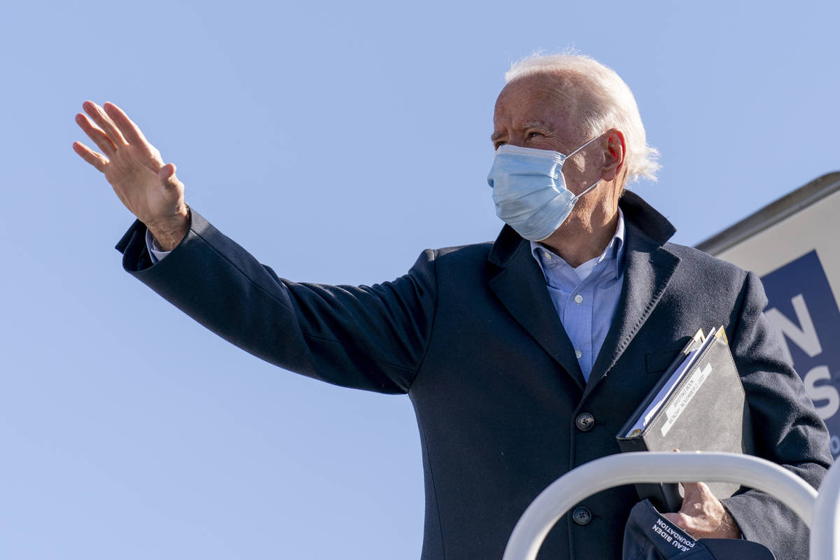 Democratic presidential candidate former Vice President Joe Biden boards his campaign plane in ...