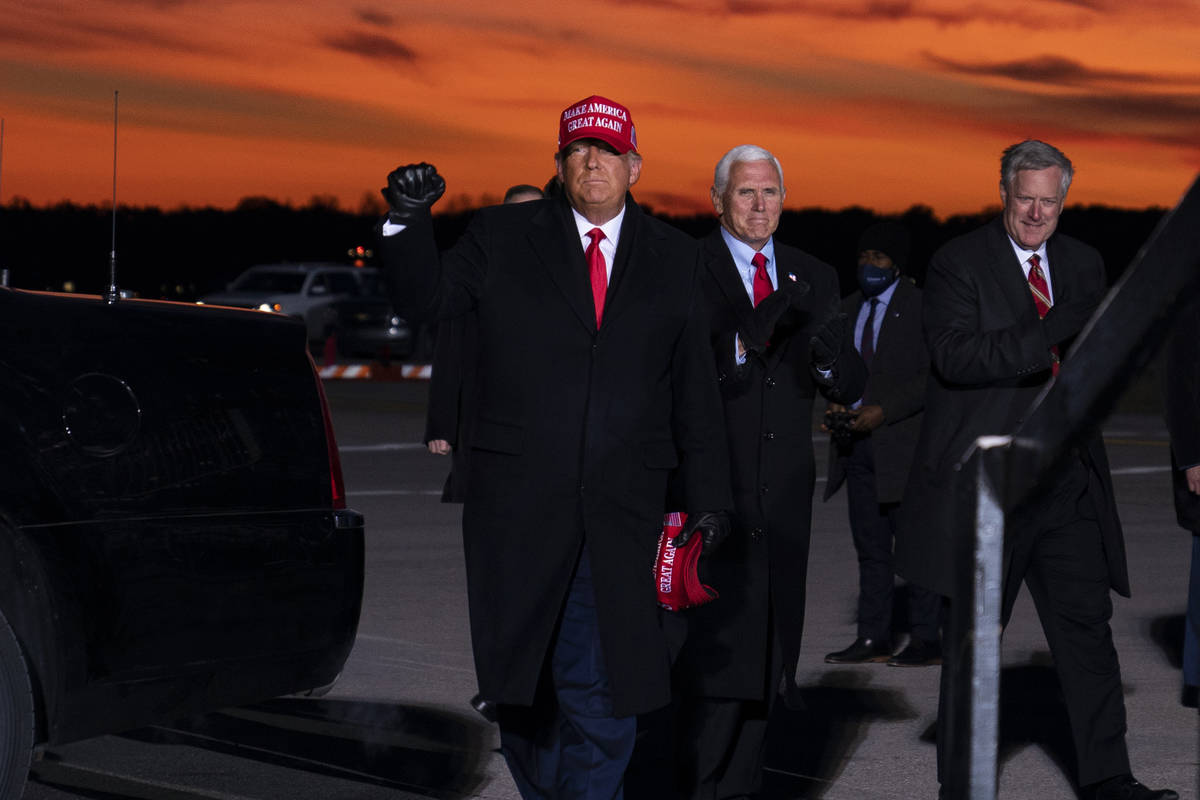 President Donald Trump and Vice President Mike Pence arrive for a campaign rally at Cherry Capi ...