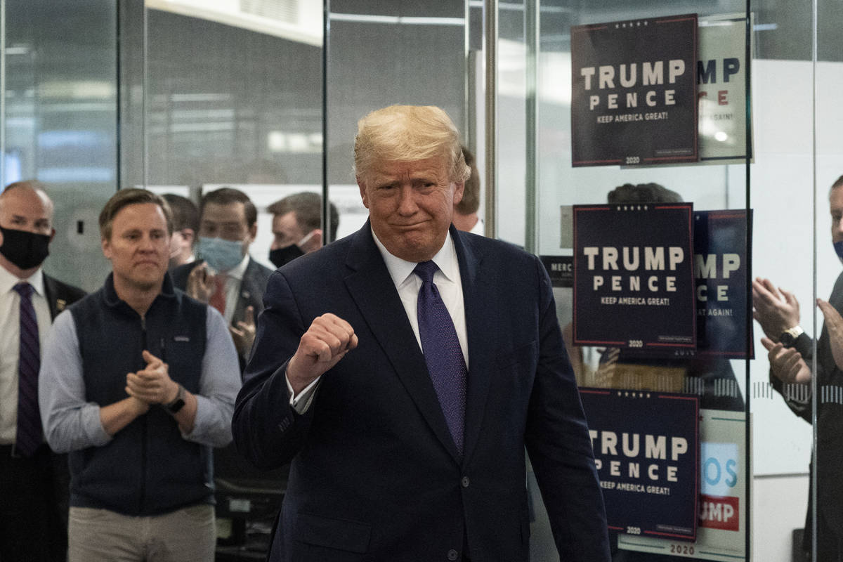 President Donald Trump arrives to speak at the Trump campaign headquarters on Election Day, Tue ...