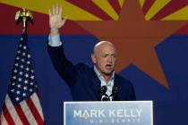 Mark Kelly, Arizona Democratic candidate for U.S. Senate, waves to supporters as he speaks duri ...