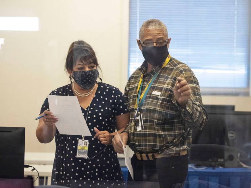 Clark County election workers conduct certification of the counting system at the Election Cent ...