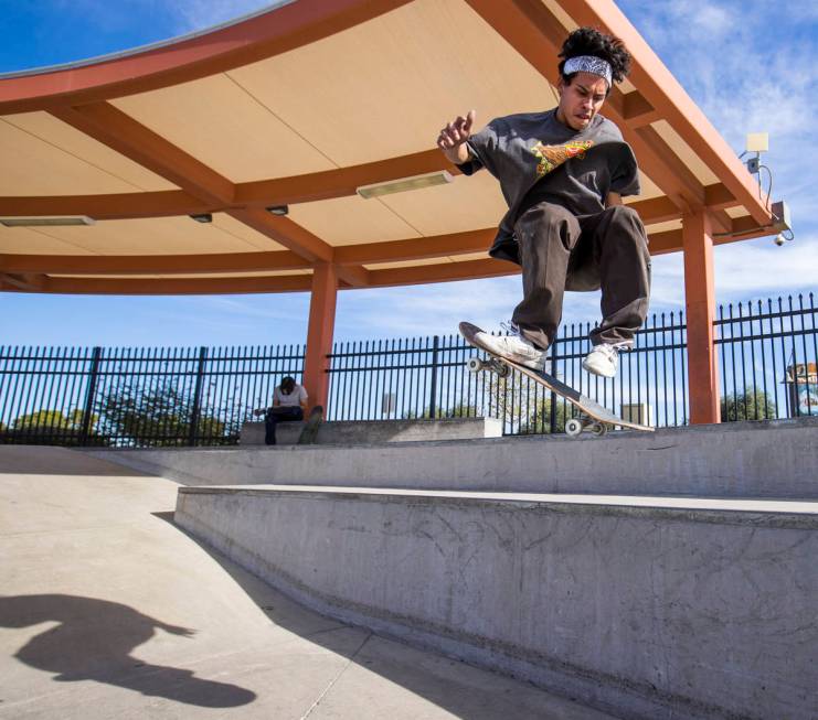 Skateboarder P.J. Dellatan catches some air while completing a backside 360 maneuver at the Cra ...
