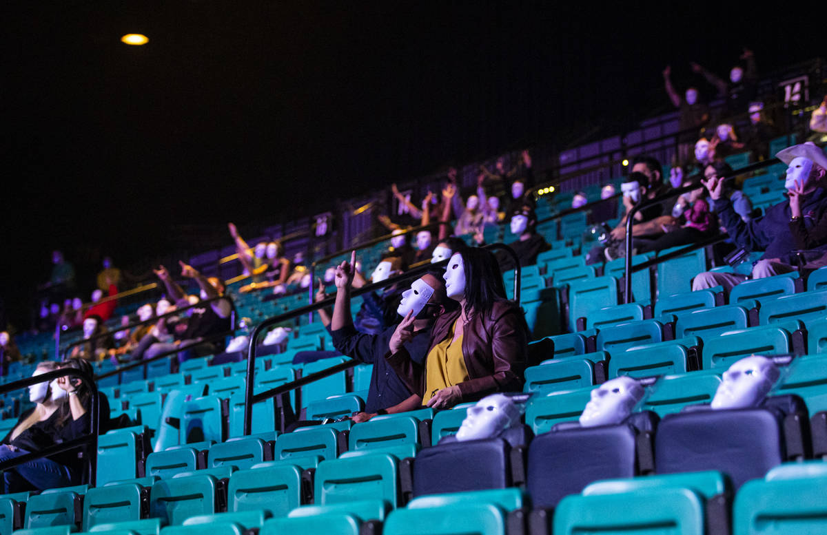 People pose in their Jabbawockeez masks before the beginning of the group's new production, &qu ...