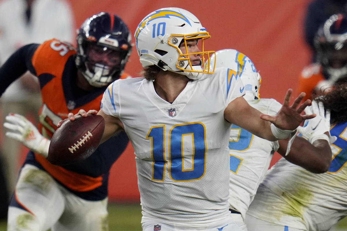 Los Angeles Chargers quarterback Justin Herbert (10) throws against the Denver Broncos during t ...