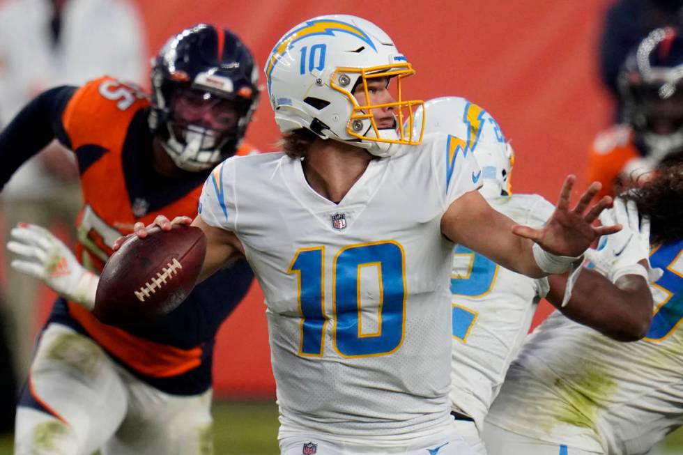 Los Angeles Chargers quarterback Justin Herbert (10) throws against the Denver Broncos during t ...
