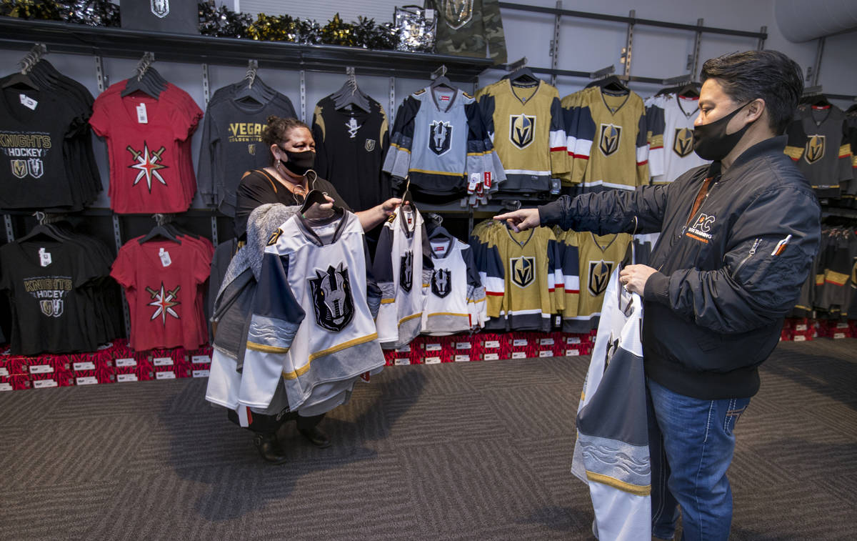 Nicole Pablico, left, and Bobby Pablico choose items to purchase at The Livery team store durin ...