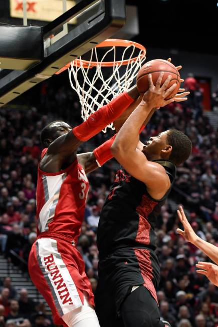 San Diego State forward Matt Mitchell, right, is fouled by UNLV forward Cheikh Mbacke Diong (34 ...