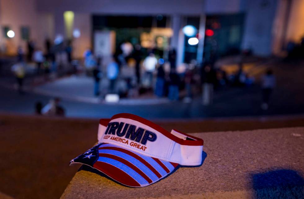 A President Donald Trump hat on the ledge as protests continue outside the Clark County Electio ...