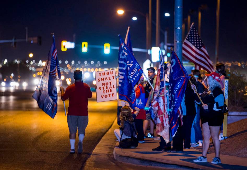 Protesters line W. Cheyenne Ave. as they gather outside the Clark County Election Department at ...