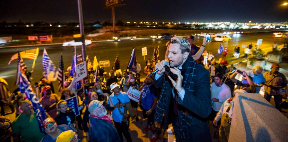 Activist Mike Coudrey fires up the crowd for President Donald Trump as protests outside the Cla ...