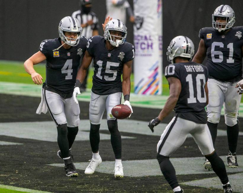 Las Vegas Raiders wide receiver Nelson Agholor (15) celebrates his touchdown with quarterback D ...