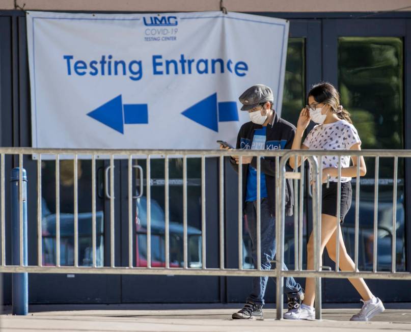 People enter the COVID-19 testing offered at Cashman Center in partnership with University Medi ...