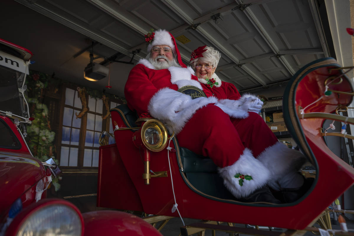 Chris Groeschke, 64, left, and Nancy Jean Gray, 72, as "Santa Kris Kringle" and Mrs. Claus, are ...
