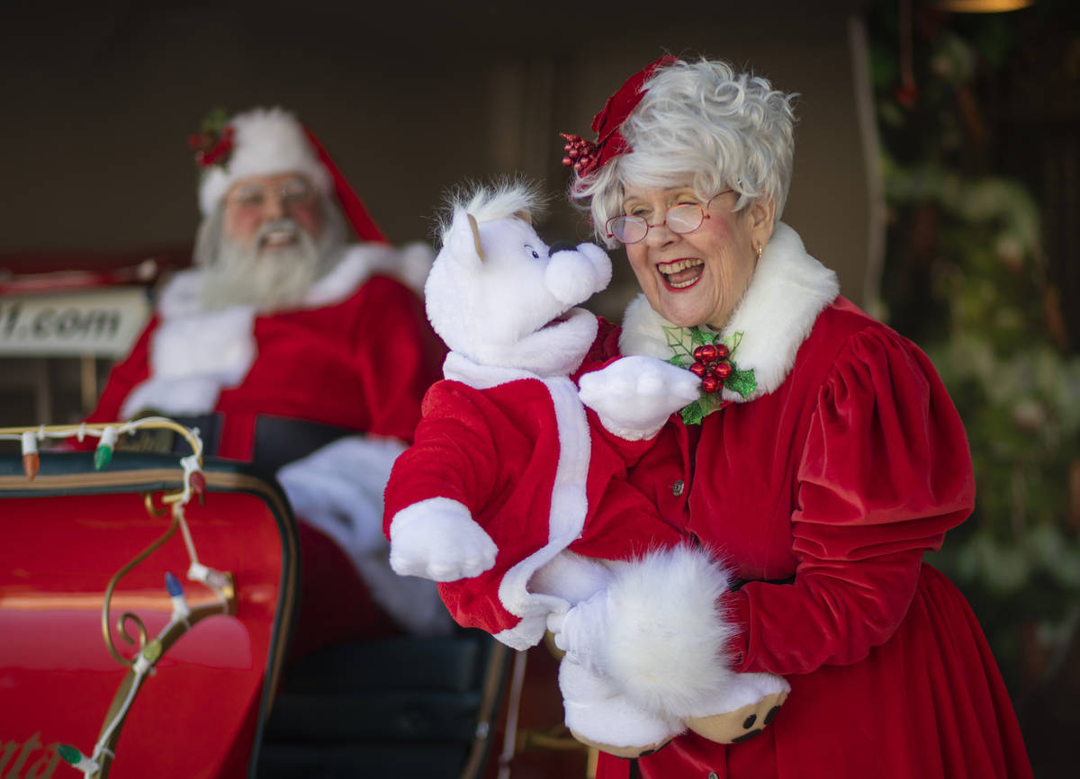 Chris Groeschke, 64, left, and Nancy Jean Gray, 72, as "Santa Kirs Kringle" and Mrs. ...