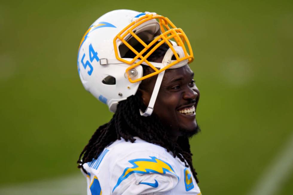 Los Angeles Chargers defensive end Melvin Ingram III (54) smiles on the sidelines against the D ...