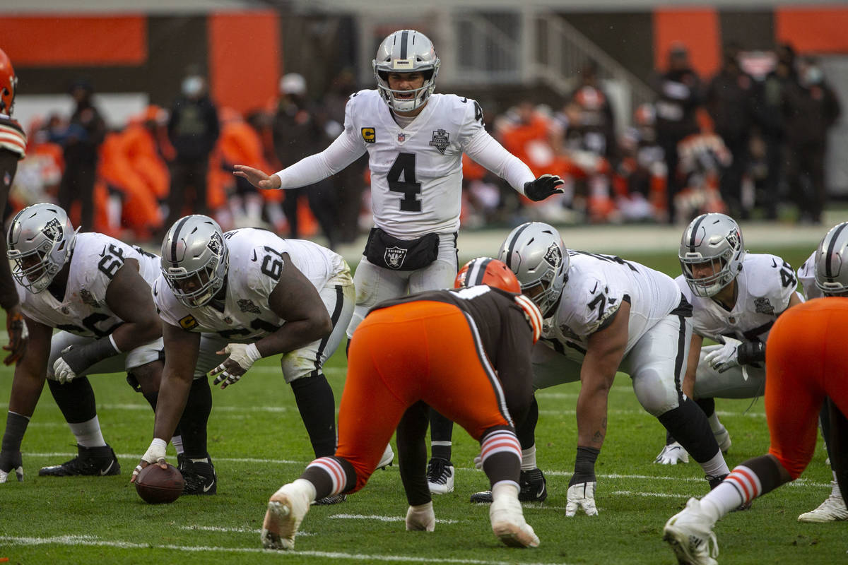 Las Vegas Raiders quarterback Derek Carr (4) calls a play at the line of scrimmage during the 1 ...