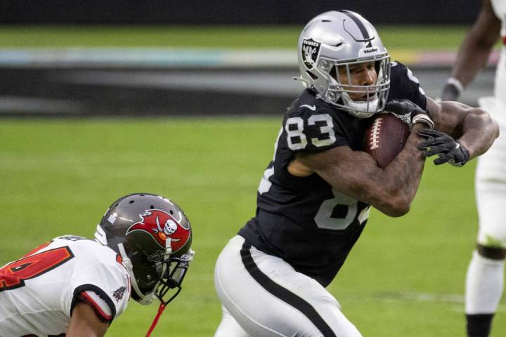 Las Vegas Raiders tight end Darren Waller (83) cuts up field past Tampa Bay Buccaneers cornerba ...