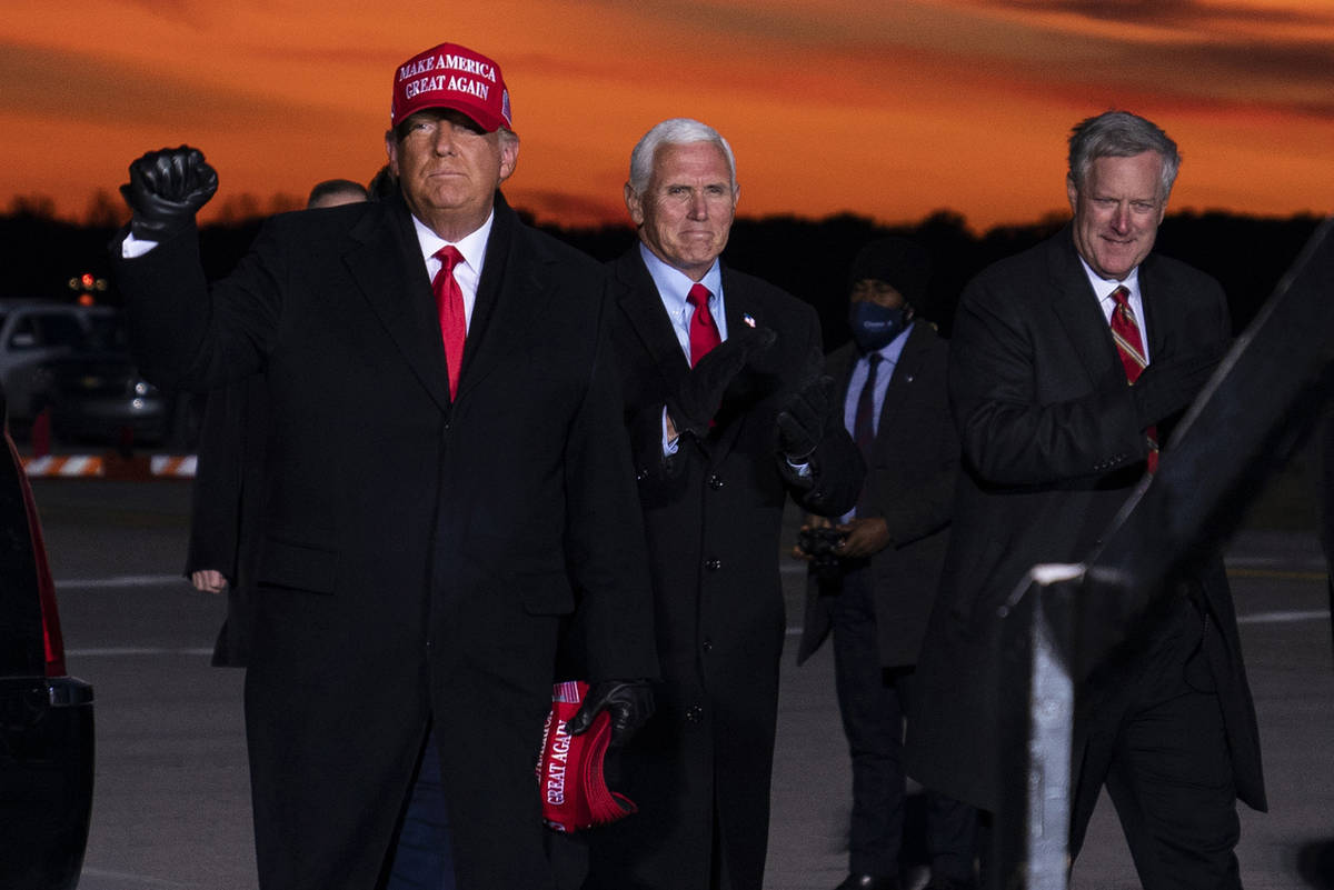 President Donald Trump and Vice President Mike Pence arrive for a campaign rally at Cherry Capi ...
