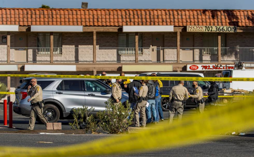 Las Vegas police meet as they investigate a homicide in the central valley near 3280 South Wynn ...