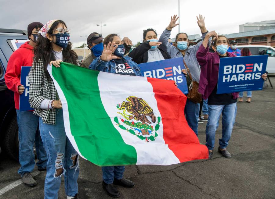 People cheer during a car parade to celebrate the former Vice President Joe Biden's victory ove ...