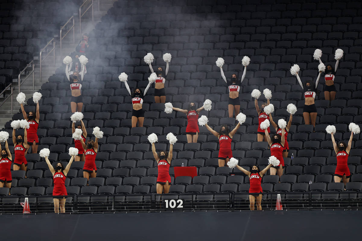 Cheerleaders make noise during first quarter of the NCAA football game between the UNLV Rebels ...