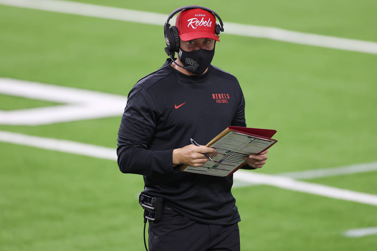 UNLV Rebels head coach Marcus Arroyo on the field during the first quarter of their NCAA footba ...