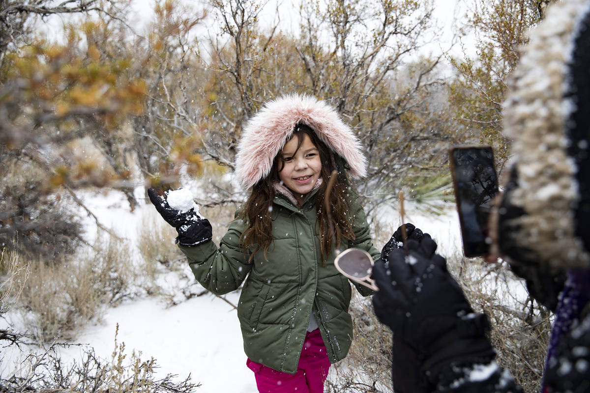 Giselle Gonzalez takes a photo of her niece Janelle Gonzalez, 8, at Mt. Charleston on Sunday, N ...