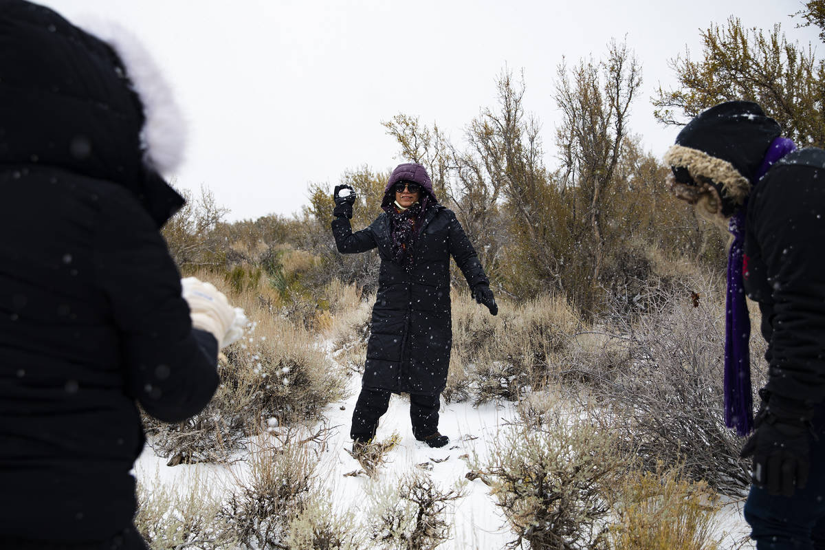 Cassandra Gonzalez throws a snowball at her family at Mt. Charleston on Sunday, Nov. 8, 2020. S ...