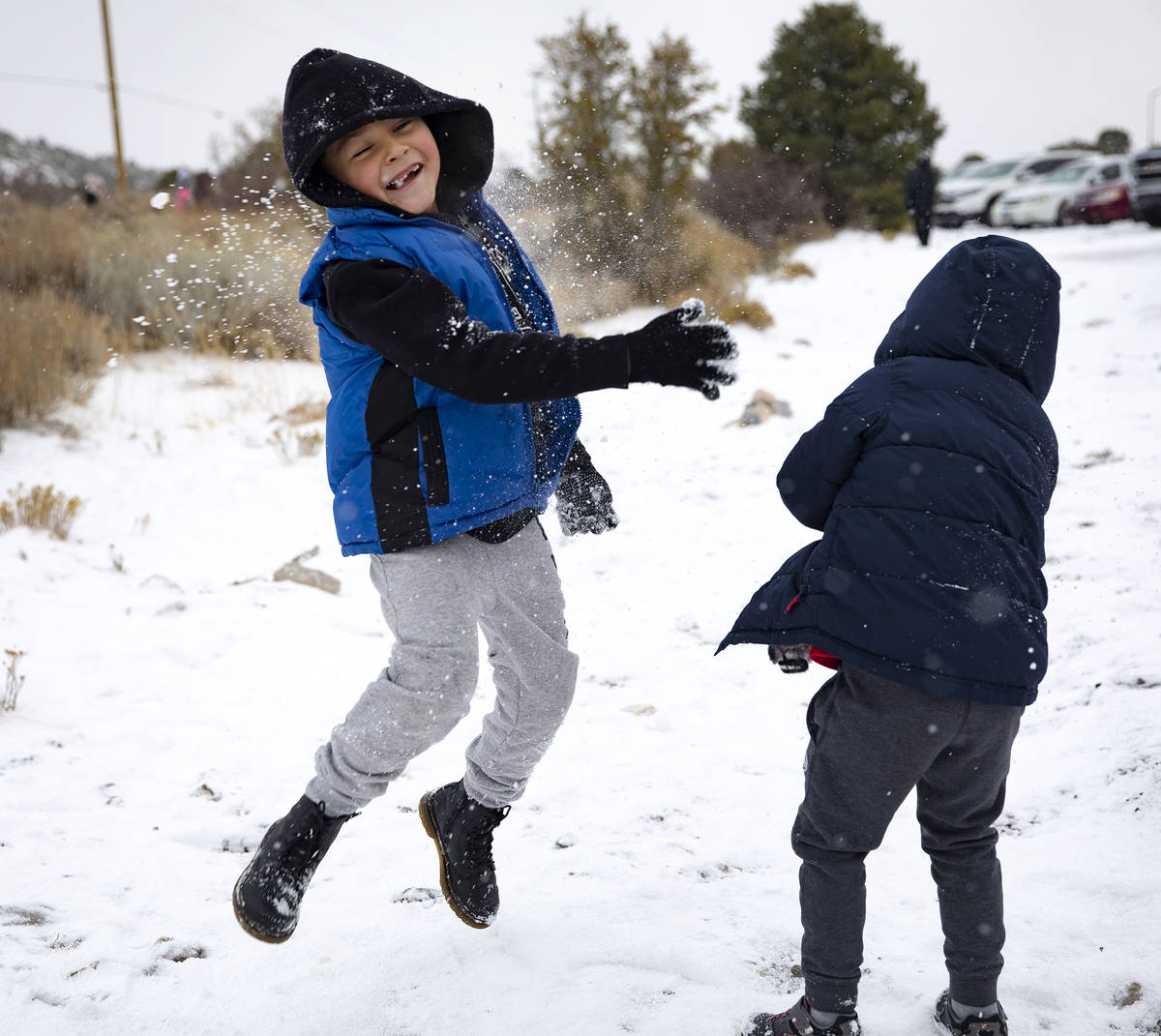 Aaron Vasquez, 8, is hit with a snowball while playing with his brothers at Mt. Charleston, Sun ...