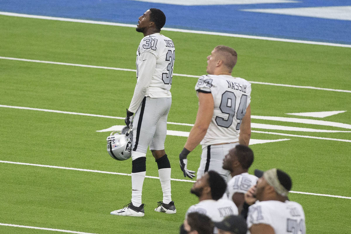 Las Vegas Raiders cornerback Isaiah Johnson (31) watches a replay of his stop of Los Angeles Ch ...