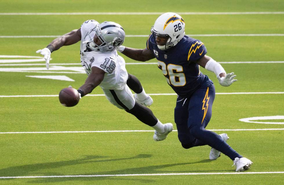 Las Vegas Raiders wide receiver Nelson Agholor (15) leaps to try and make a catch over Los Ange ...