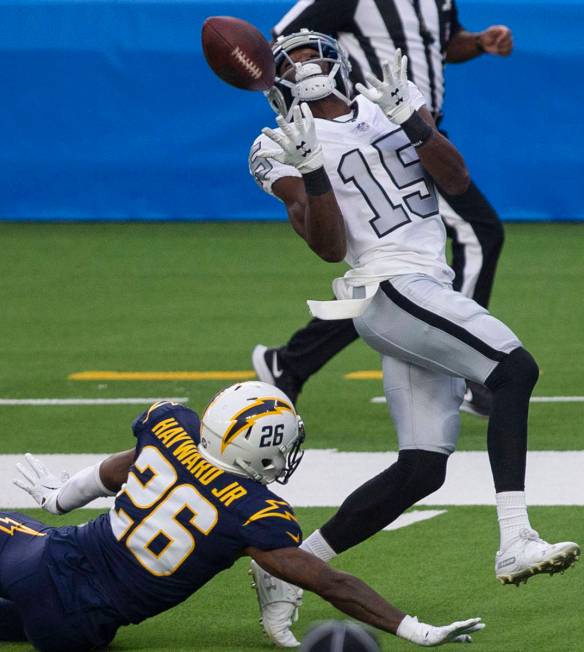 Las Vegas Raiders wide receiver Nelson Agholor (15) prepares to make a catch over Los Angeles C ...