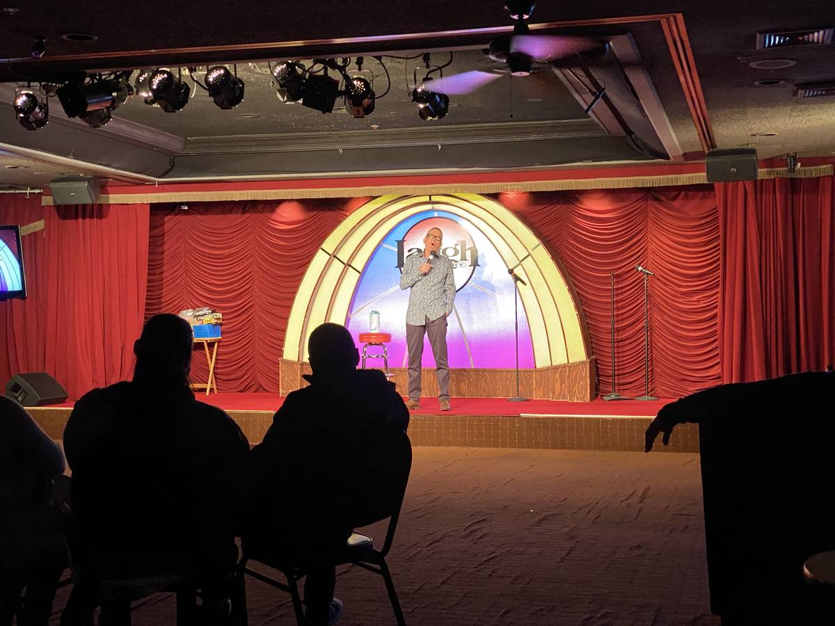 Veteran comic Brian Kim is shown onstage for a socially distant audience at Laugh Factory at th ...