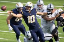 Los Angeles Chargers quarterback Justin Herbert (10) throws a pass under pressure during the fi ...