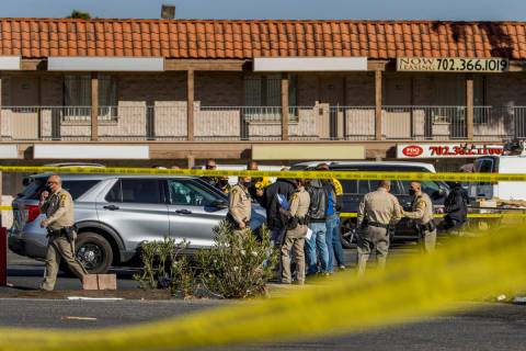 Las Vegas police meet as they investigate a homicide in the central valley near 3280 South Wynn ...