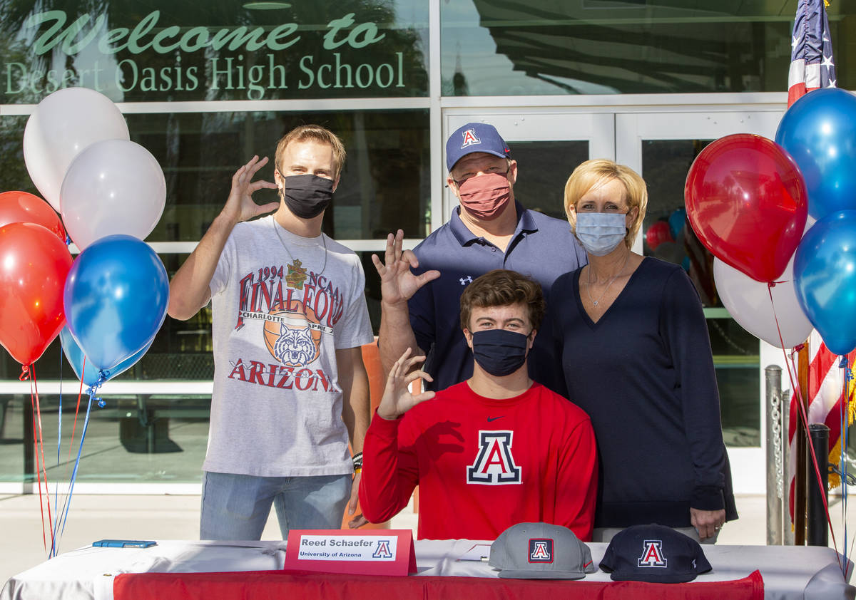 Reed Schaefer, who will play baseball at University of Arizona next year, poses for a photo wit ...
