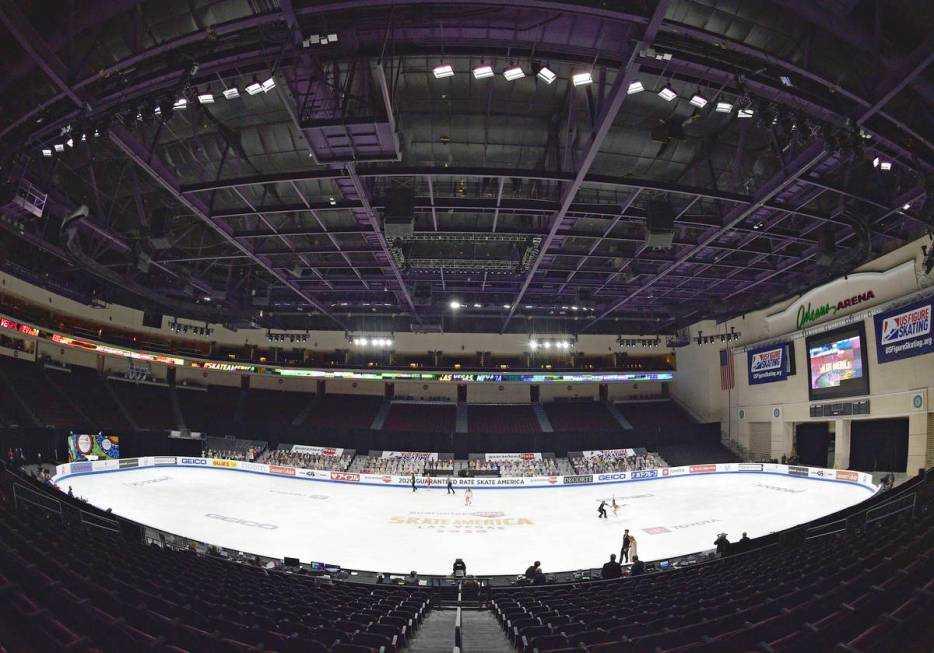 Skaters warm up before the ice dance free dance program in the International Skating Union Gran ...