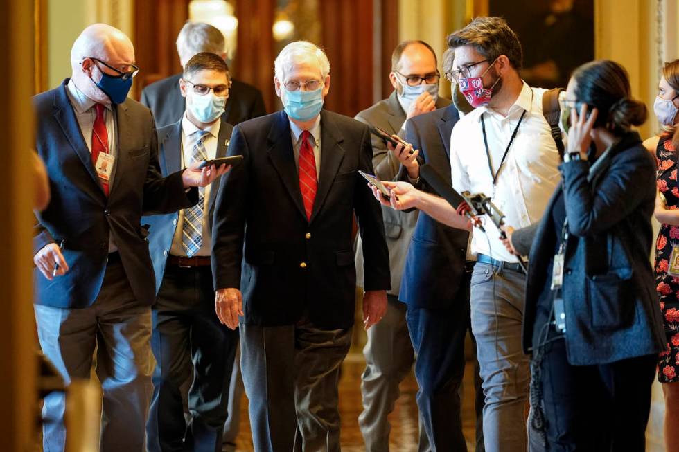 Senate Majority Leader Mitch McConnell of Ky., talks with reporters after he spoke on the Senat ...