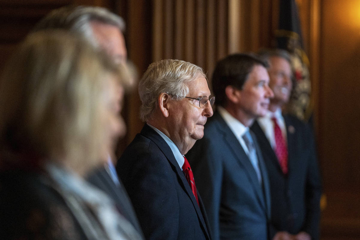 Senate Majority Leader Mitch McConnell of Ky., poses with newly elected Republican senators, ...
