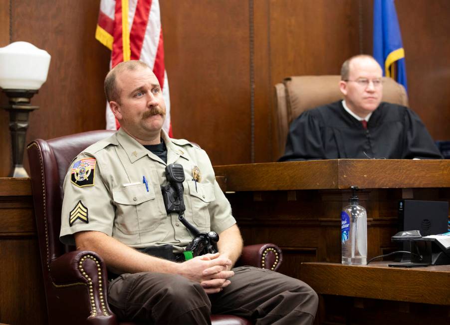 White Pine County Sheriff's Office Sgt. Nathan Mingo, left, testifies about his jail interactio ...