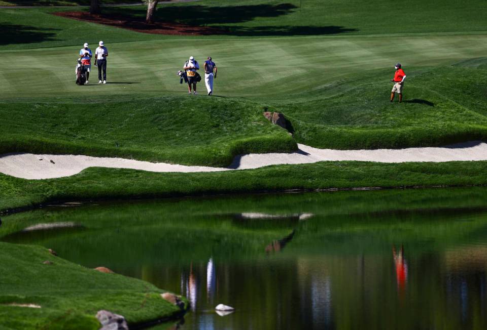 Golf players wait to head to the fourth green during the third round of the CJ Cup at the Shado ...