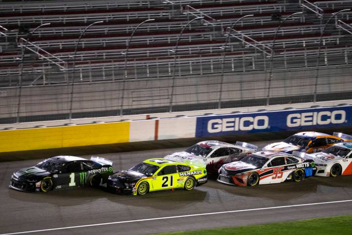 Drivers trail behind race winner Kurt Busch (1) during a NASCAR Cup Series auto race on Sunda ...