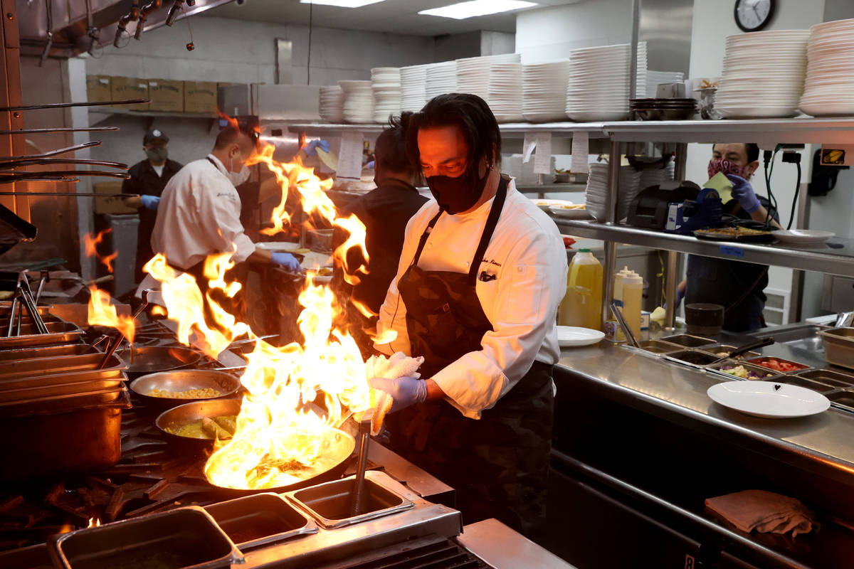 Chef Mike Minor shown cooking at Border Grill in July, has been in Las Vegas since 1982 (K.M. C ...