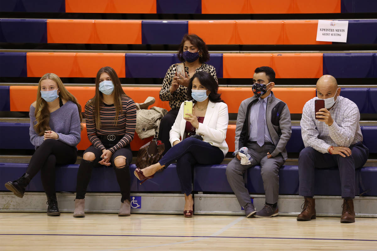 Family members attend a Signing Day ceremony at Bishop Gorman High School in Las Vegas, Thursda ...