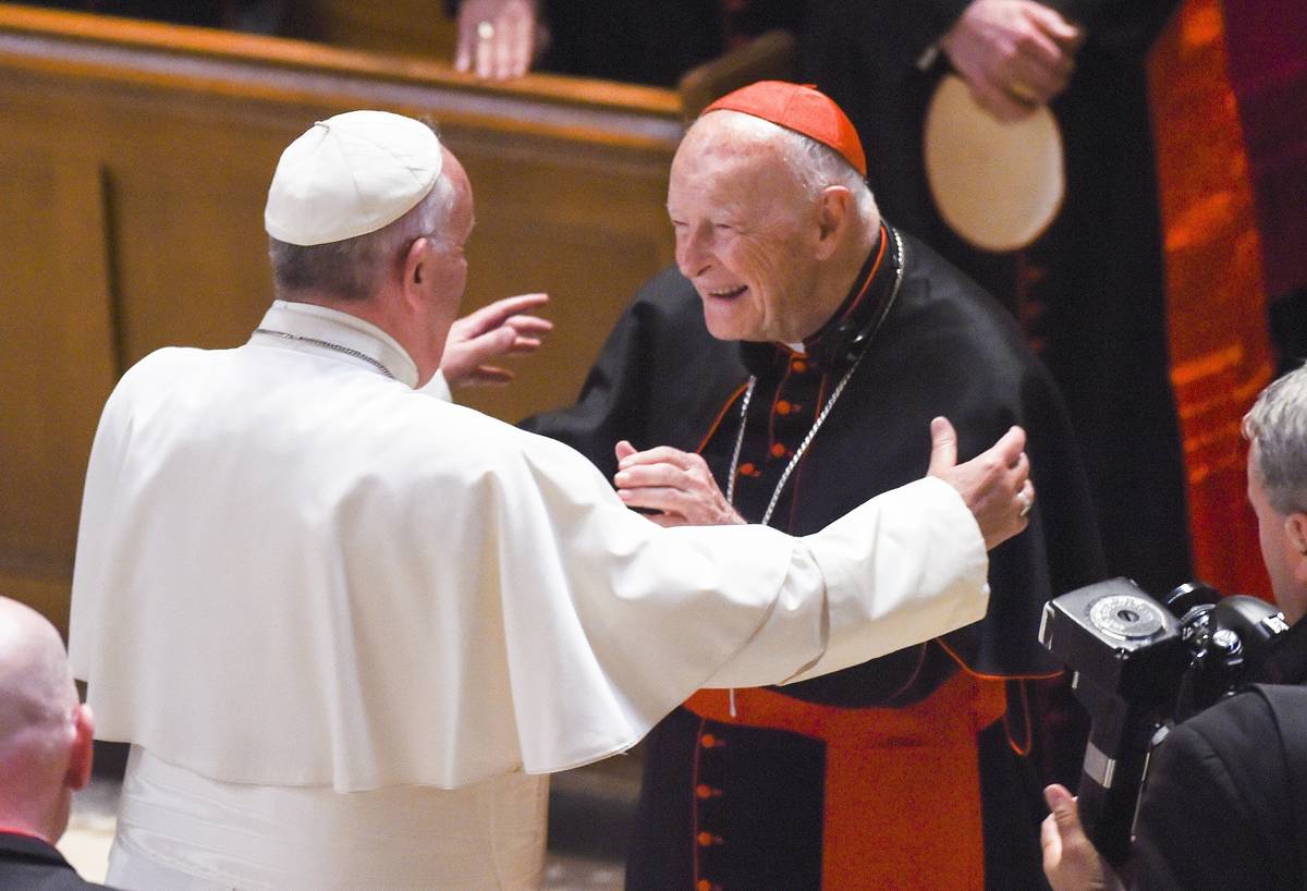 In this Sept. 23, 2015, file photo, Pope Francis reaches out to hug Cardinal Archbishop emeritu ...