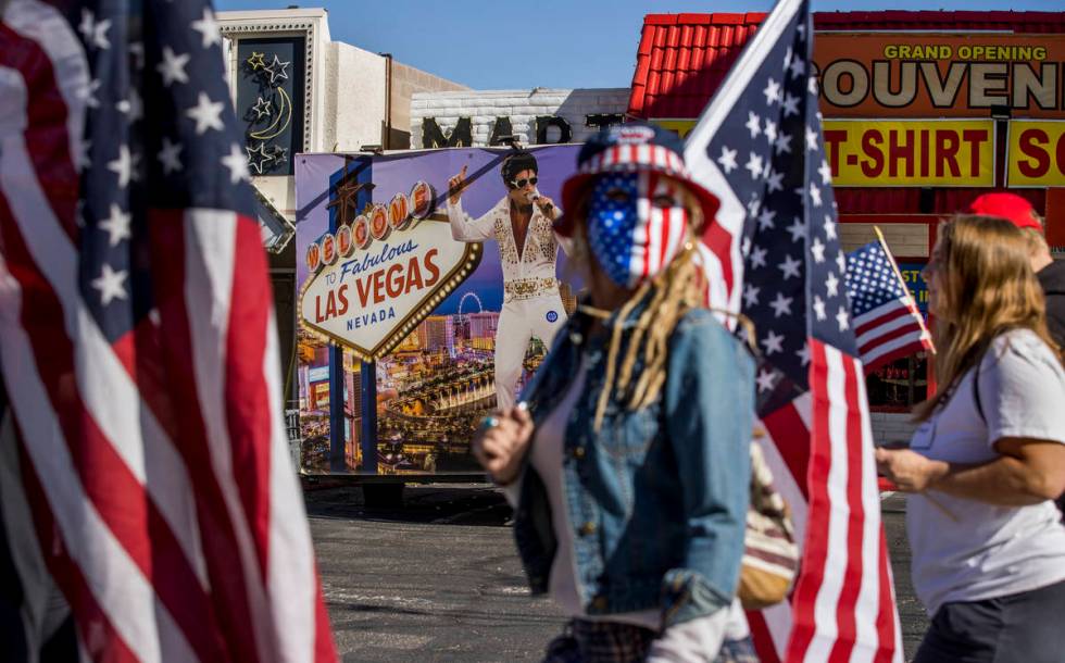 Wetoniah Houlihan walks with others during a Veterans Day march to peacefully protest Governor ...