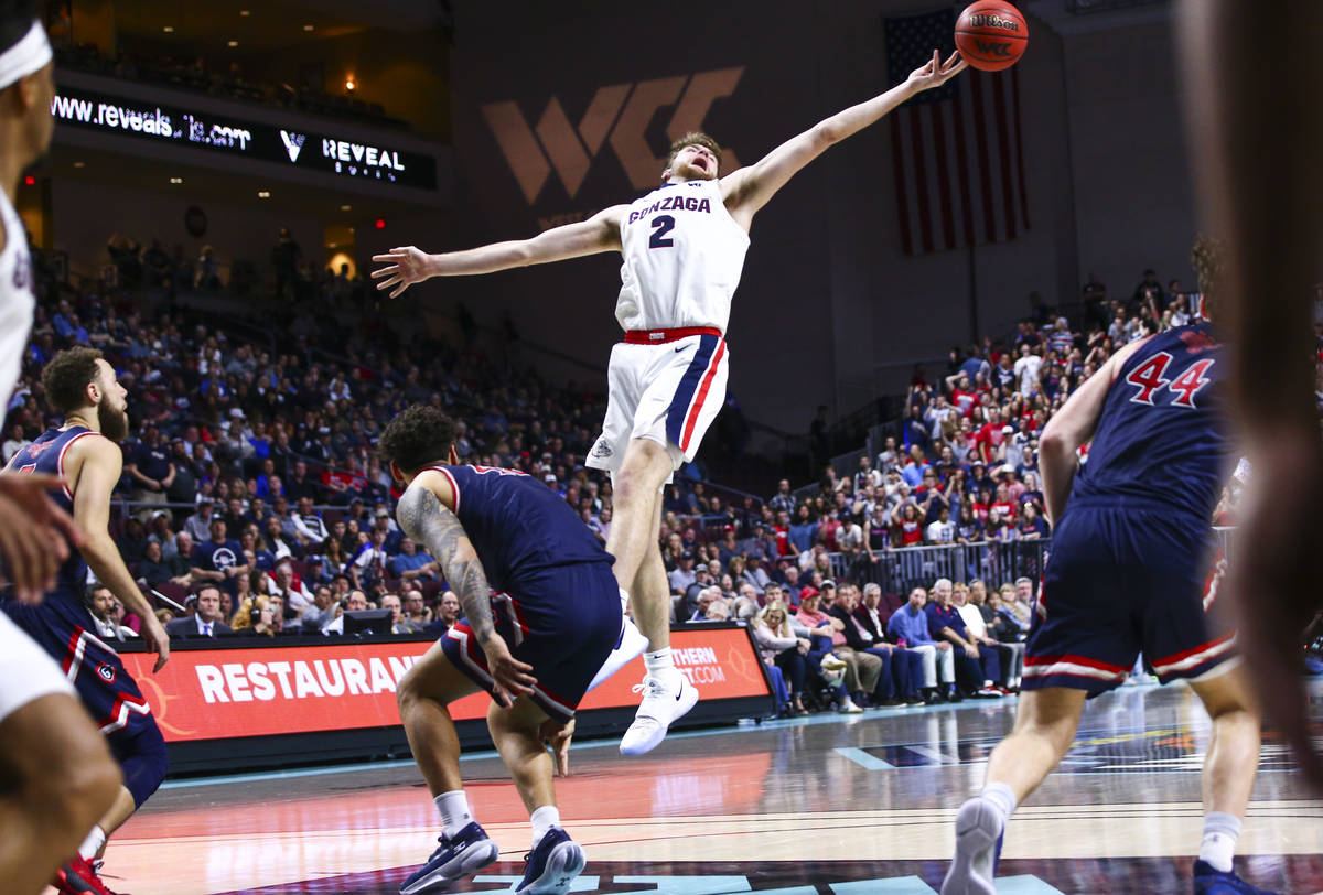 Gonzaga Bulldogs' Drew Timme (2) reaches for a rebound during the second half of the West Coast ...