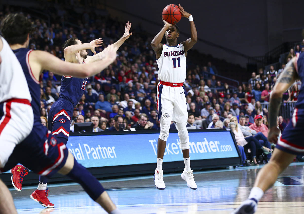 Gonzaga Bulldogs' Joel Ayayi (11) shoots against the St. Mary's Gaels during the second half of ...