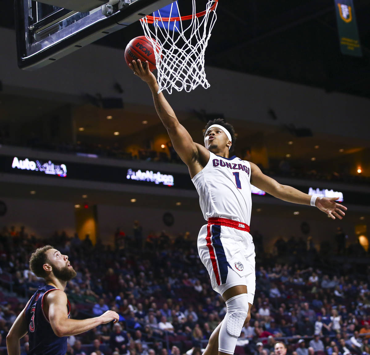 Gonzaga Bulldogs' Admon Gilder (1) goes to the basket in front of St. Mary's Gaels' Jordan Ford ...